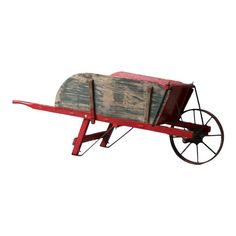 an old wooden wagon with wheels is shown on a white background and has red paint