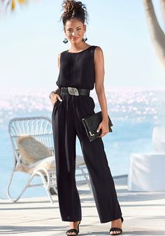 This classic cut, sleeveless jumpsuit takes you from casual to formal with ease. Black Sleeveless Jumpsuit, Bra Fitting Guide, Statement Skirt, Swim Trends, Jumpsuit Black, Work Wear Women, One Piece Suit, Sleeveless Jumpsuits, Online Fashion Stores