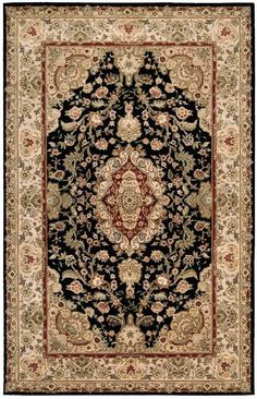 a black and beige rug with an ornate design