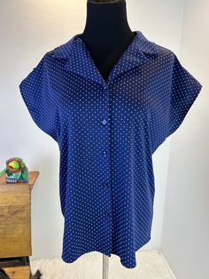 1960s blouse / 60s blouse / vintage blouse / 1970s fashion / 70s blouse  This blouse is 1960s does 1940s. She navy blue with white polka dots. She has a button up front and cute button trimmed sleeves. She looks amazing with a skirt or with pants. She can double as a 1940s or 1950s item she is styled to be late 40s early 50s Measurements provided are flat and have been doubled. This item is meant  to be worn a bit loose Bust 42" Waist 42" Length 23" ❤️ Condition: Excellent vintage condition. Flaw: none. This item has been cleaned and is ready to wear. $68 includes domestic shipping. International shipping is $30.  Please let me know if you have questions. I am here to help. 💜Megan Cheap Retro Blue Blouse, 1960s Blouse, 60s Blouse, 70s Mode, 70s Blouse, Fashion 1970s, Fashion 70s, 1970s Style, Vintage Blouse