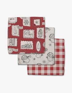 two red and white napkins on top of each other, one with an image of santa