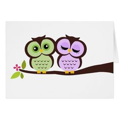 two owls sitting on a branch with their eyes closed