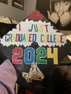 a graduation cap with the words i just graduated college 2012 written on it in multicolored letters