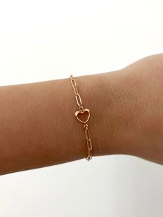 14k gold filled 6.5in link bracelet with open heart detail Cheap Open Heart Jewelry Gift, Adjustable Tarnish Resistant Yellow Gold Heart Bracelet, Dainty Gold Charm Bracelet With Adjustable Chain, Minimalist 14k Gold-filled Jewelry With Heart Charm, Adjustable 14k Yellow Gold Heart Bracelet, Heart Charm Jewelry With Oval Link For Gifts, Heart Charm Oval Link Jewelry As Gift, Adjustable 14k Gold Valentine's Day Jewelry, Adjustable Dainty Chain Bracelet With Heart Charm