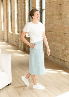 The Natalia Button Front Washed Midi Denim Skirt is the perfect denim skirt for elevated everyday looks! It features an a-line silhouette, a finished hem and full button front that is on trend and pairs perfectly with your favorite tops! It is available in two washes a light blue, and beige that will fit in any season! Dress this versatile and chic skirt up or down for endless ways to style! Style: A-line, Midi SIZING TIPS Fit | Semi-Fitted Stretch | None Our Models Sized Up Summer Straight Leg Skirt With Button Closure, Light Wash Button-up Bottoms For Work, Mid-rise Cotton Denim Skirt With Button Closure, Chic Everyday Bottoms With Buttons, Casual Wide Leg Denim Skirt For Work, Mid-rise Cotton Skirt For Workwear, Everyday Cotton Lined Skirt, Summer Workwear Denim Skirt With Button Closure, Casual Knee-length Denim Skirt With Buttons