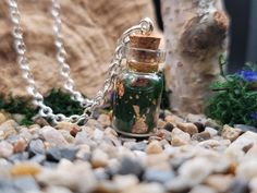 Feel a boost of inner strength and connection to nature with this Forest Guardian Potion! Made with a deep green resin and copper leaf, this necklace beautifully mimics the forest floor covered in dew drops reflecting the morning sun. Witch Potion Necklace, Forest Guardian, Potion Bottle Necklace, Glass Vial Necklace, Vial Pendant, Crystal Vial Necklace, Forest Necklace, Copper Leaf, Bottle Necklace