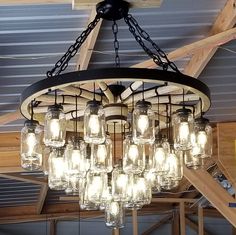 a chandelier made out of mason jars hanging from the ceiling