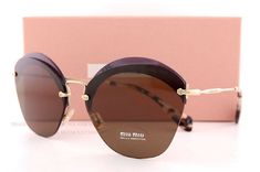 Miu Miu Sunglasses       Description   Guaranteed 100% Authentic Miu Miu Sunglasses. Condition: Brand New. Made in Italy.  Model Number: MU 53SS        Color: VX2 9L1 (Transparent Violet FRAMES; Brown LENSES) Sunglasses come with original Miu Miu paper box, hard case, cleaning cloth, and authenticity card. Size (mm):   Eye | Bridge | Vertical(B) | Temple |   | | |     62 | 16 | 53 | 140 |                  SHIPPING & GENARAL INFORMATION We take PayPal only. Free Priority Mail shipping within the Brown Rimless Sunglasses With Mirrored Lenses, Brown Rimless Sunglasses With Tinted Lenses, Brown Rimless Tinted Sunglasses, Brown Rimless Polarized Sunglasses, Miu Miu Casual Sunglasses With Gradient Lenses, Brown Rimless Sunglasses With Gradient Lenses, Casual Miu Miu Sunglasses With Gradient Lenses, Brown Gradient Rimless Sunglasses, Miu Miu Casual Sunglasses With Mirrored Lenses