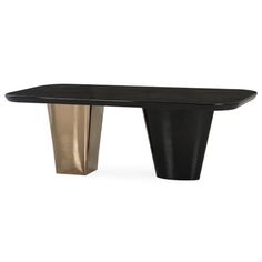 a black and gold dining table with one leg bent down to the side, in front of a white background