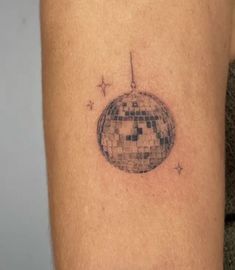 a tattoo with a disco ball on it