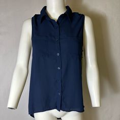 Moon Collection Brand Size Large Navy Blue Sleeveless Blouse New ! Chic Blue Tank Top For Work, Sleeveless Blue Blouse For Work, Casual Sleeveless Blue Blouse, Chic Blue Tank Vest, Casual Tank Blouse For Work, Casual Sleeveless Workwear Blouse, Blue Tank Vest Blouse, Blue Sleeveless Vest For Work, Blue Sleeveless Vest For Workwear