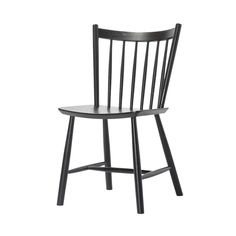 a black wooden chair on a white background with no one in the room to see it