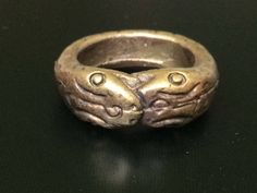 "This is a perfect and unique style magic ring made of brass metal by Lp Imm from Hua-khao temple. The power of the ring is to protect all dangers including ghost, evils and devils and the ring can bring good luck, fortune and wealth to the wearer. The ring showcases an elegant design with unique holy amulet. It is great to get this ring for your loved one or treat yourself for a classic timeless style. Amulet Name: Magic Nakabast Magic Ring Ring details: The exact benefit of the talisman and symbol means Naga lasso (Buang Nak Bas) ring Lucky amulet... Protection from danger.\" Those who own it know well the phrase, \"If you have something to eat... you won't go hungry. You eat like a snake eats its tail, and each one eats. The more you eat, the more they come together. When they hit each Symbolic Hand Cast Ring Jewelry, Antique Bronze Hand Cast Ring, Symbolic Adjustable Engraved Snake Ring, Symbolic Engraved Adjustable Snake Ring, Adjustable Engraved Symbolic Snake Ring, Symbolic Hand Cast Adjustable Rings, Spiritual Hand Cast Adjustable Rings, Adjustable Antique Finish Spiritual Jewelry, Adjustable Bronze Rings With Antique Finish