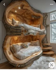 a bed made out of wood in the middle of a room