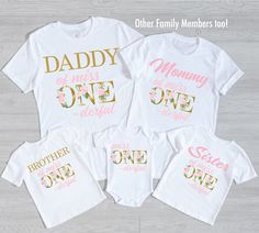 three matching shirts with the words daddy, mommy and me printed on them in gold