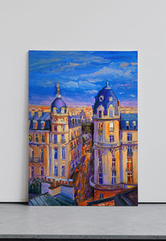 an oil painting of some buildings on a wall