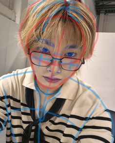 a person with glasses and a striped shirt