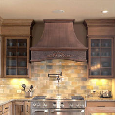 a stove top oven sitting inside of a kitchen next to wooden cabinets and counter tops