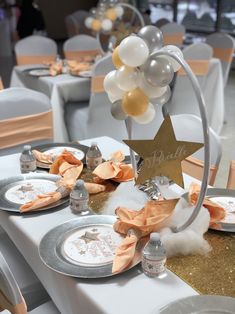 a table set up with plates and silverware for a bridal party or baby shower