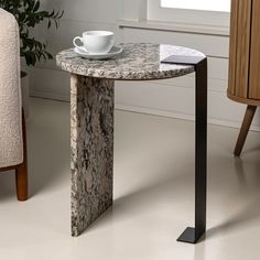 a marble table with a coffee cup on it