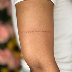 a woman's arm with writing on it