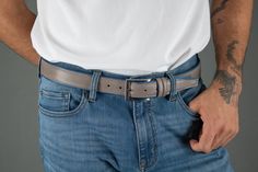 The Back Nine Golf Belt is just what every gentleman needs for those casual days. Pair this belt with shorts, jeans, or khakis and you are ready to conquer the day. With its distinguished full-grain leather over nylon, this leather belt adds a pop of color to your outfit. Handcrafted in Italy, this leather belt is perfect to complete your look on the golf course. You can wear this golf belt as a casual item around the house or when out and about. The double keeper and nickel buckle are sure to k Casual Leather Belts And Suspenders, Casual Leather Belts For Business, Casual Leather Belt For Business, Golf Belt, Fabric Belt, Shorts Jeans, Tan Lines, Leather Belts, Waist Pants