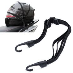 motorcycle helmet and leash attached to the back of a motorbike