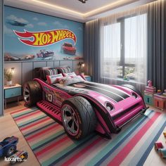 a bedroom decorated in pink and black with hot wheels theme