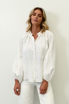 Capture the essence of luxury fashion with the gorgeous Hansel blouse from Lunar Fox. Crafted from a delightful linen in classic white, this is a stand out piece that you can rely on for any occasion. FEATURES: Full length rouleau button loops Long balloon style sleeves Drop shoulders Relaxed fit FABRIC/CARE:Main | 100% LinenCold hand wash Short Playsuit, Denim Joggers, Long Balloons, A Stand, Skirt Leggings, Pull On Pants, Long Hoodie, Outerwear Coats, Knit Jumper