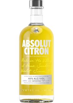 an empty bottle of absolut citron on a white background with the label in cursive writing