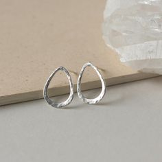 These minimalist studs are a stylish jewelry staple. They're made of sterling silver wire in an elegant teardrop shape and I've hammered it for texture and shine. The studs are 15mm long and about 12mm at their widest making them a perfect size for every day wear. I've soldered sterling silver posts to the tops of them and they are held securely in place with sterling silver backings. The earrings are very lightweight and comfortable to wear and the simple design makes them a versatile accessory Minimalist Teardrop Drop Earrings, Minimalist Sterling Silver Teardrop Jewelry, Minimalist Teardrop Sterling Silver Jewelry, Minimalist Sterling Silver Drop Earrings For Everyday, Minimalist Hammered Teardrop Jewelry, Everyday Minimalist Sterling Silver Drop Earrings, Everyday Minimalist Sterling Silver Drop, Dainty Hammered Teardrop Earrings, Simple Teardrop Earrings For Everyday