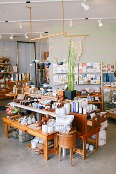 the interior of a craft shop with lots of items