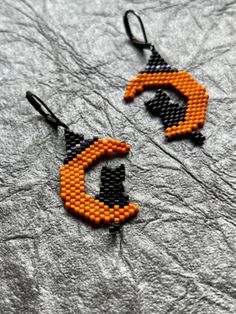 🎃 Celebrate the spooktacular season with our Halloween Earrings featuring an orange moon and a mischievous black cat. These bewitching earrings are the perfect accessory to add a touch of Halloween magic to your style. 🎁 **Perfect Gift Whether you're treating yourself or surprising a fellow Halloween enthusiast, these earrings make a fantastic gift choice. They come beautifully packaged, ready to enchant. 🍂 **Versatile Wear These earrings effortlessly transition from your Halloween costume to Cheap Spooky Orange Earrings, Black Cat Jewelry, Orange Moon, Halloween Magic, Cat Jewelry, Halloween Earrings, Fantastic Gifts, Handmade Accessories, Halloween Costume