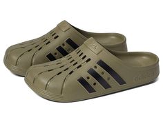 adidas Adilette Clog - Shoes : Focus Olive/Black/Focus Olive : For a casual, cool vibe, head to your work out in the comfy adidas Adilette Clog. Based on the iconic adidas slide, these sport-inspired clogs have a soft feel and are both functional and comfortable featuring a contoured EVA footbed. Sport-inspired clogs with a soft feel. Slip-on construction. Contoured EVA footbed. Regular fit. Upper, lining, insole, and outsole made of synthetic material. Imported. Measurements: Weight: 5 oz Produ Sporty Slip-on Slides For Outdoor Activities, Non-slip Sporty Slides For Outdoor Activities, Sporty Non-slip Slides For Outdoor Activities, Sporty Slip-resistant Clogs For Outdoor Activities, Sporty Synthetic Slip-on Clogs, Adidas Sporty Slides With Rubber Sole, Adidas Sports Slides With Rubber Sole, Sporty Adidas Logo Slides For Streetwear, Adidas Synthetic Slip-on Clogs