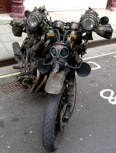 a motorcycle with gas masks on it parked in the street