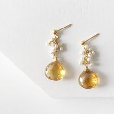 Cluster Citrine Earrings / Wire Wrapped Citrine and Pearls/ Dangle Ethnic Jewelry / Gold Tear Drop Bohemian Earrings / Gemstone EarringsThe earrings was crafted beautifully with citrine and pearls to match the tone. The details are sophisticated and wrapped with gold filled wire to make the piece lasts a long time. This stunning earrings are the must have addition to any jewelry box ♥Wire                         : Gold FilledLength of earrings: 1.80 inchesStone                       : Citrine an Amber Dangle Earrings With Natural Stones, Citrine Drop Earrings For Wedding, Citrine Earrings With Gemstone Accents As Gift, Gold Citrine Earrings With Gemstone Accents, Amber Teardrop Earrings With Natural Stones, Gold Bohemian Earrings With Gemstone Accents, Handmade Teardrop Citrine Earrings, Citrine Dangle Earrings For Pierced Ears, Citrine Dangle Earrings With Ear Wire