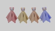 three teddy bears are wrapped in towels on a gray background and one is brown, the other is blue