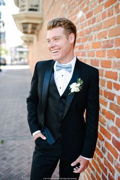 Lighten up the look of the classic black tuxedo with a light blue bow tie. Photography: Mr. and Mrs. Wedding Duo Tux For Prom, Black Suit Bow Tie, Groomsmen Attire Black, All Black Tuxedo, Classic Black Tuxedo, Light Blue Bow Tie, Prom Tux, Tuxedo Prom, Prom Tuxedo