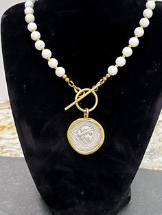 This is a necklace made by me using a romantic replica of an Ancient Greek coin. The chain is made with a zinc and nickel free gold alloy metal and is offered in 3 lengths.  Thank you for looking! White Coin Pendant Jewelry, White Coin Pendant Medallion Necklace, White Coin Pendant Necklace As A Gift, White Medallion Necklace With Coin Pendant, White Coin Pendant Necklace For Gift, White Coin Pendant Necklace, White Medallion Coin Pendant Necklace, White Coin Necklace With Round Pendant, White Round Coin Pendant Necklace