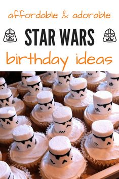 cupcakes with white frosting and star wars hats on them