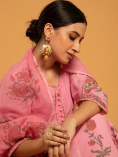 Set of 3 consists of kurta, pants, and dupatta. Reviving the age-old technique of hand block printed florals in red and green set on a majestic bed of pink soft handwoven cotton. Kurta: Delicately gathered kurta with ghera adorned in hand block printed flowers, 3/4th sleeves, and gold gota detailing on the hemline & sleeves, set in pure cotton Dupatta: Handwoven kota doria dupatta, complete with customized block prints Pants: Pink straight-fit pants in soft cotton Fit: Fitted at bust and waist. Kurta Pants, Printed Flowers, Straight Fit Pants, Cotton Dupatta, Kurta With Pants, Kurta Set, Best Face Products, Printed Pants, Pink Cotton