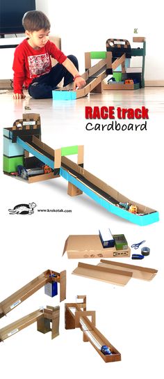 a young boy playing with a cardboard race track