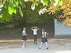 three girls are standing in front of a tree with their hands on their hipss