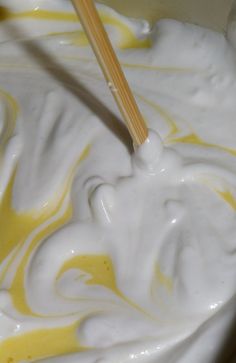 a bowl filled with white and yellow liquid