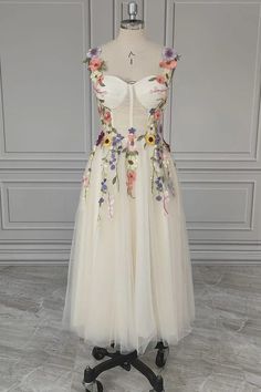 a white dress with flowers on it