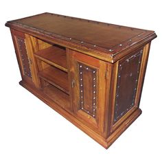 an old fashioned wooden entertainment center with rivets and studded leather doors on the front