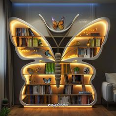 a butterfly shaped book shelf with books on it's sides and lights in the middle