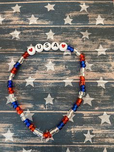 This is a USA Patriotic beaded bracelet. It would make a great addition to a woman's or teen's 4th of July outfit. It would make a great gift for a birthday gift. It has white USA letter beads. It has two heart beads. It has red, clear, and blue seed beads. It was made with .8mm sturdy stretch string. I tie it several times to prevent breakage. It fits most teens and women. It stretches to fit on the wrist. All items are ready to be shipped I do combined shipping. Items ship in 2-5 business days. Check out more items at: http://www.etsy.com/shop/MesheleCrafts  https://www.facebook.com/MesheleCrafts Usa Bracelet, Patriotic Bracelet, 4th Of July Outfit, 4th Of July Outfits, Usa Patriotic, Fits Women, Letter Beads, Two Hearts, Heart Beads