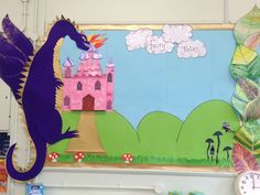 a bulletin board with a purple dragon on it and a pink castle in the background