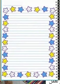 an open notebook with stars on it and pencils next to the page that is written in